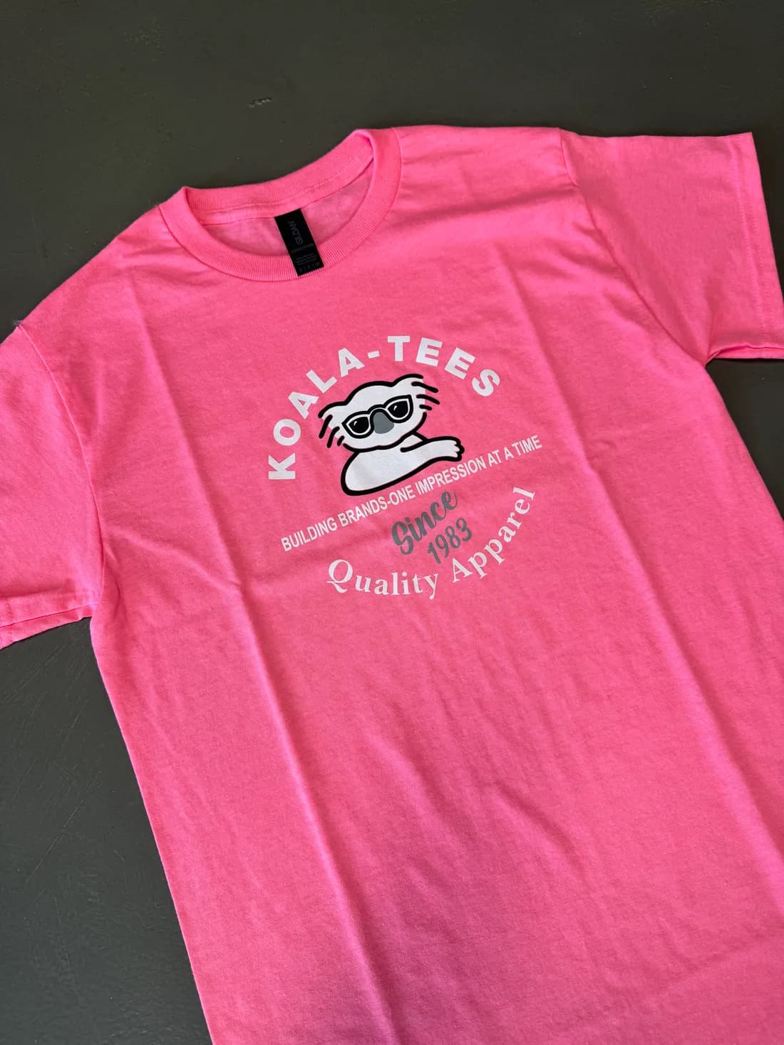 Pink Gildan 5000 tee with the Koala-Tees shop logo printed on the chest