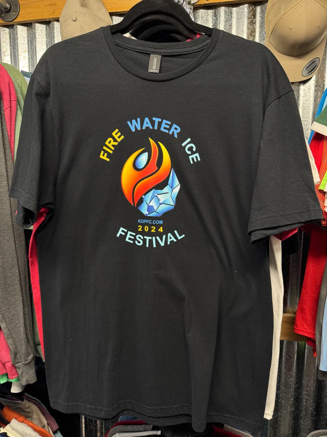 Black Gildan Softstyle tee with a full-color Fire Water Ice Festival 2024 print for the Kearns Oquirrh Park Fitness Center