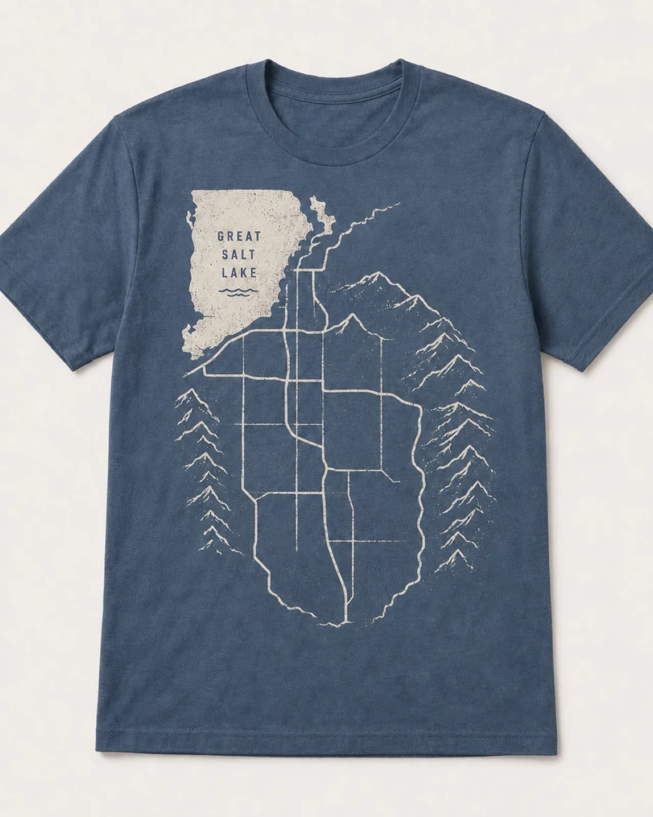 Custom navy t-shirt printed with a Salt Lake Valley map - Great Salt Lake, the I-15 corridor, and the Wasatch peaks