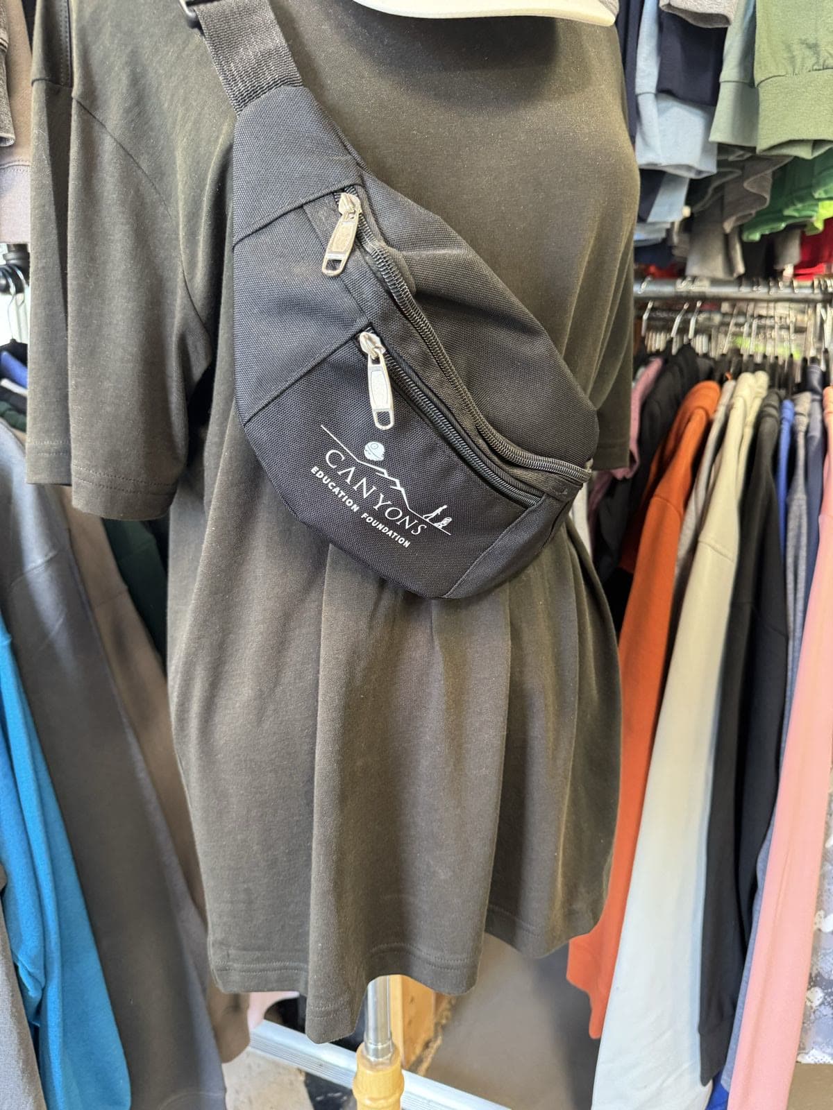Custom-printed black bag with the Canyons Education Foundation logo, made by Koala-Tees